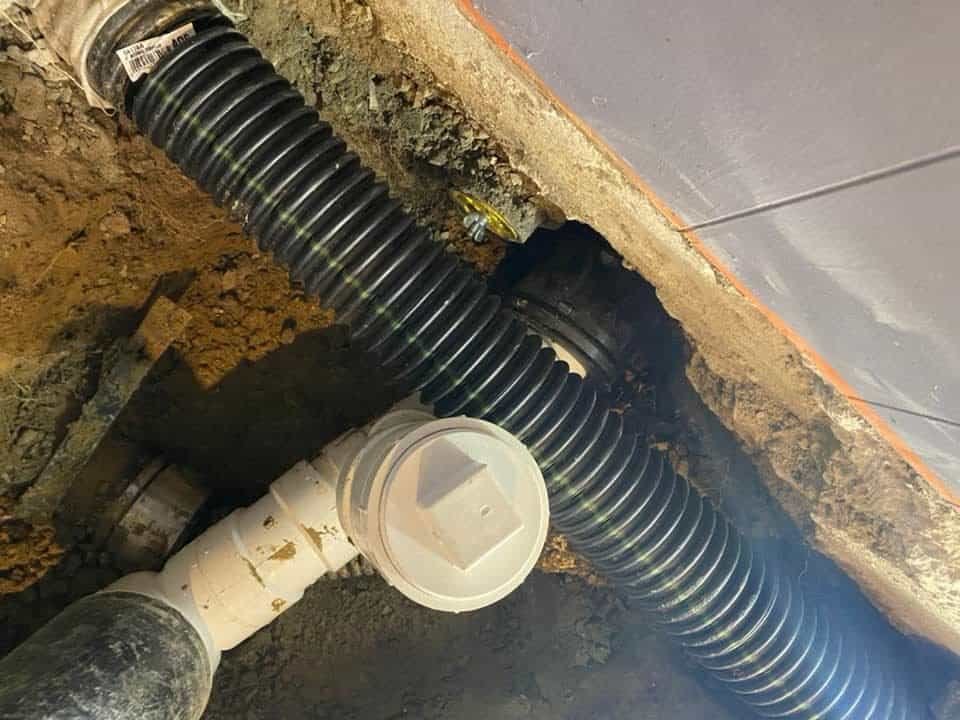 Thompson Trenchless and Hydro Jetting works on pipe repairs under concrete, showing safe and proper fixes for home plumbing.