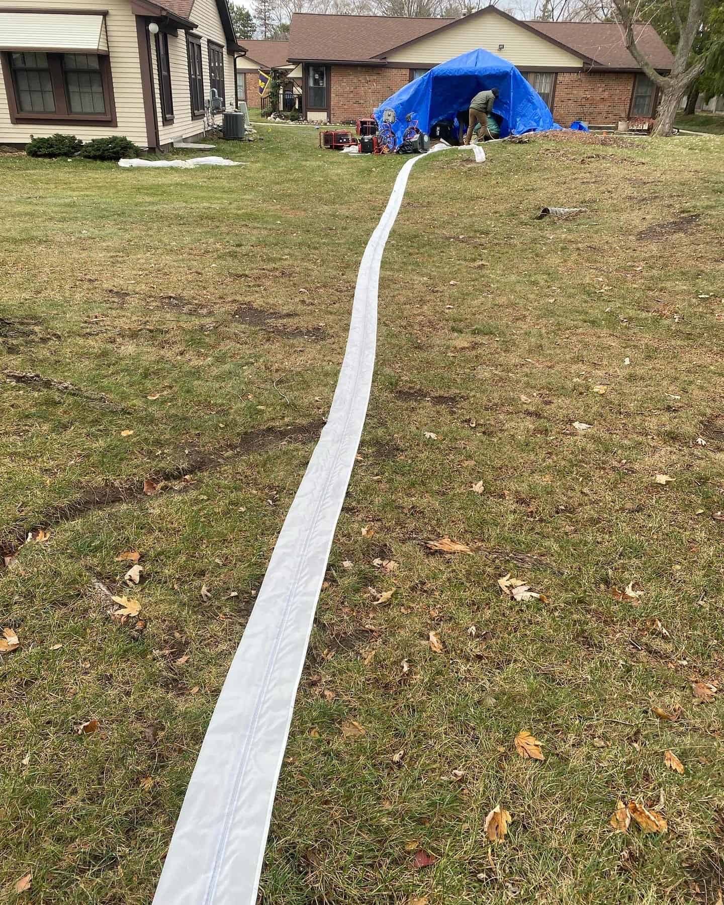 Thompson Trenchless and Hydro Jetting repairs sewer lines in a suburban yard, showing safe, modern service for homes.