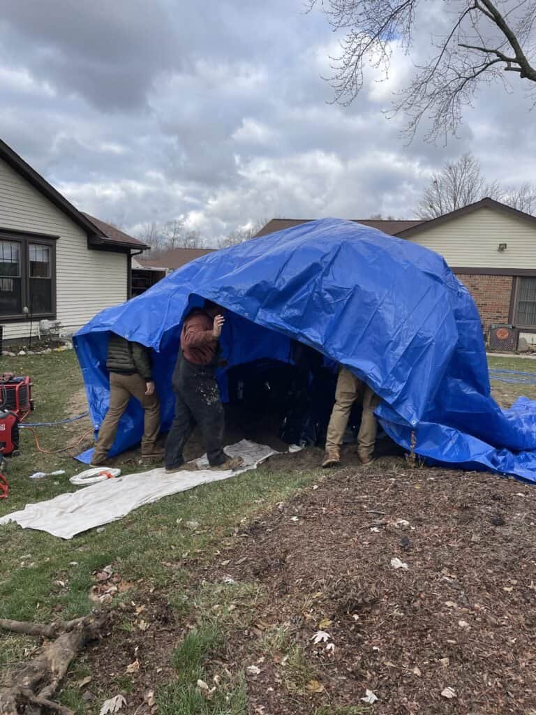 Thompson Trenchless and Hydro Jetting crew gets ready to clear a home's sewer line using safe, modern hydro jetting methods.