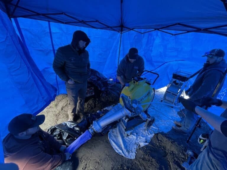 Thompson Trenchless and Hydro Jetting team repairs a pipe using special equipment after inspecting it for damage.