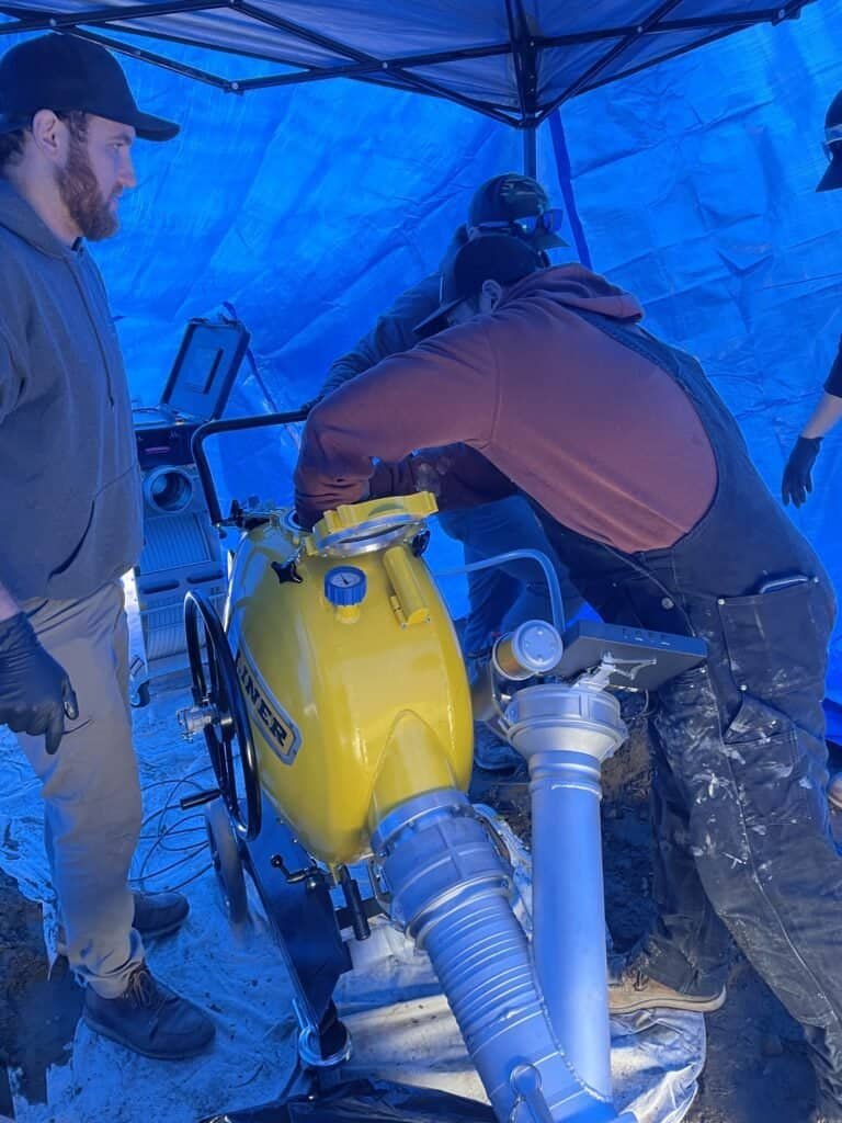 Thompson Trenchless and Hydro Jetting team inspects pipes using special equipment to ensure everything works safely.