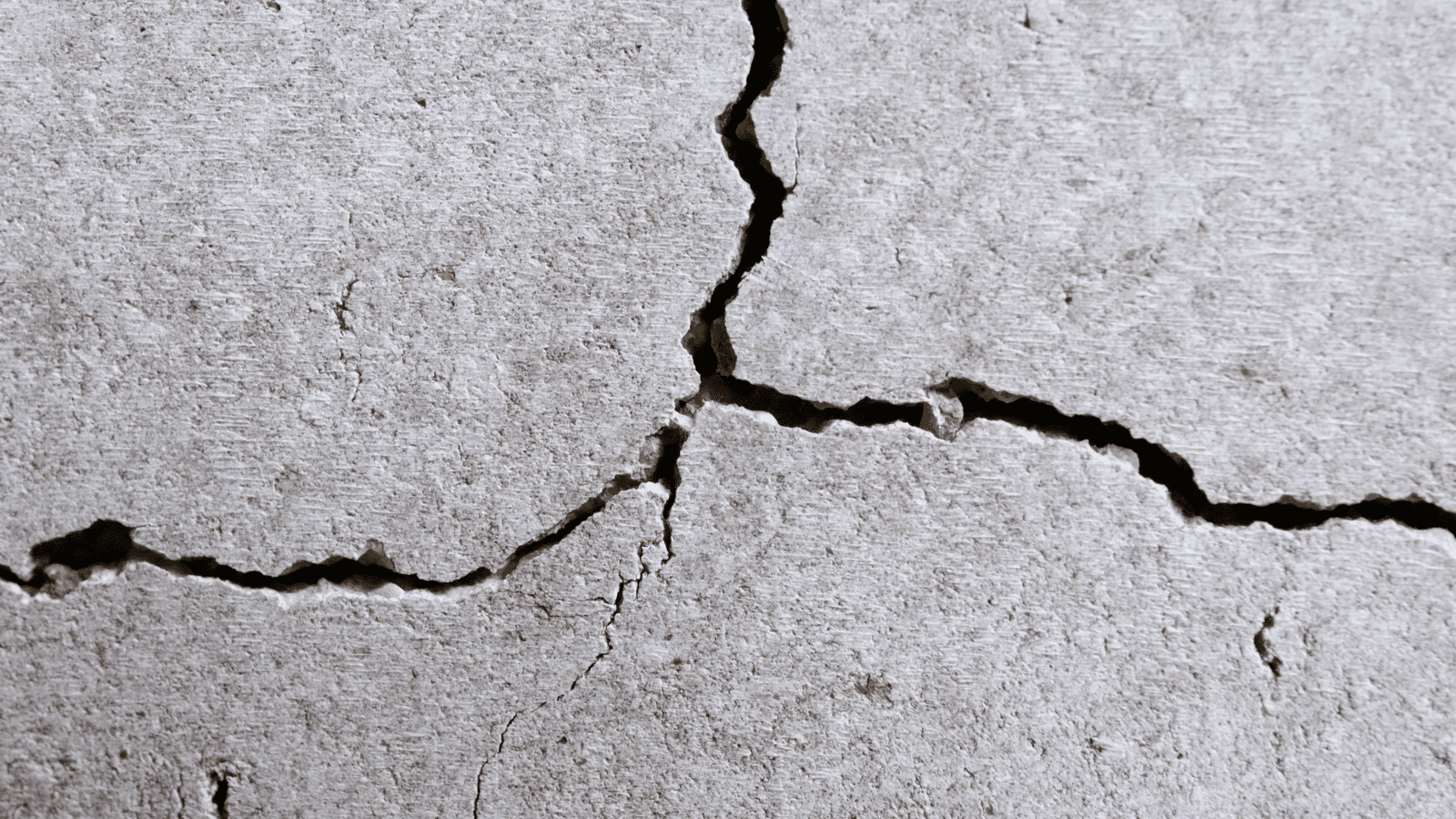 Concrete damage needing attention from Thompson Trenchless and Hydro Jetting for pipe or drain repair.