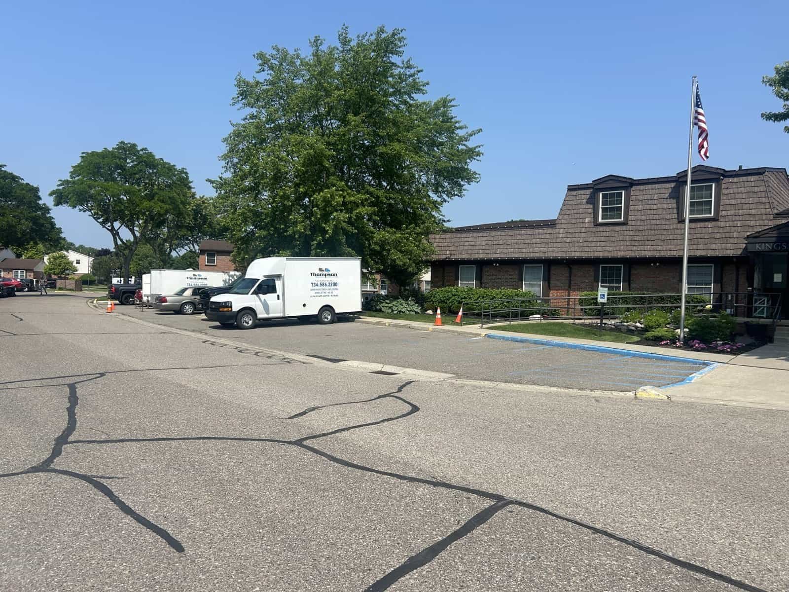 Thompson Trenchless and Hydro Jetting provides pipe inspection services at an office building on a sunny day.