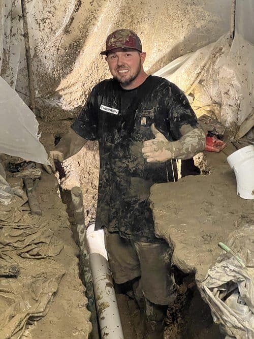 A happy worker for Thompson Trenchless and Hydro Jetting gives a thumbs up on site, ready to help with your pipe needs.