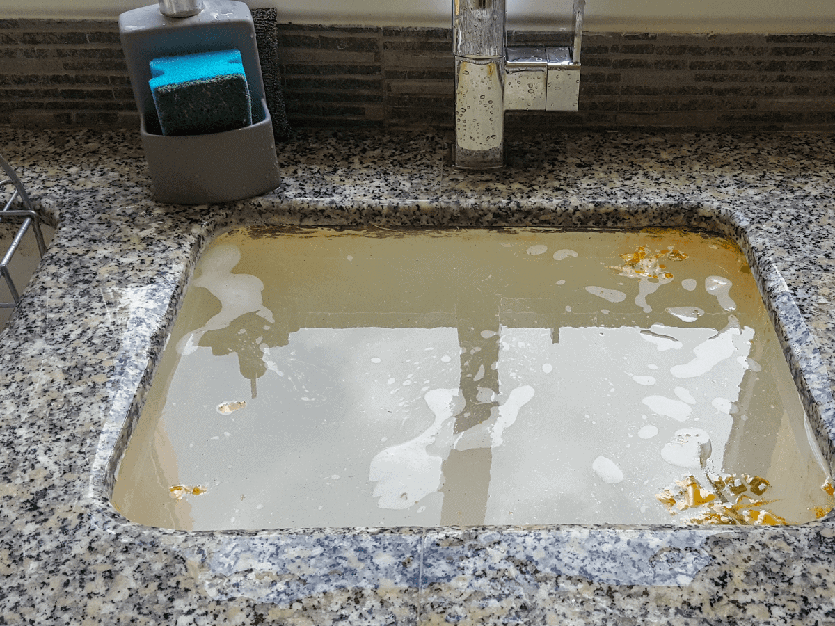 A clogged kitchen sink shows water isn’t draining right. Thompson Trenchless and Hydro Jetting can help fix the problem fast.