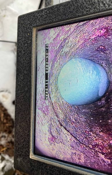 Thompson Trenchless and Hydro Jetting shows a pipe blockage found during an inspection in winter. Repair work is underway.