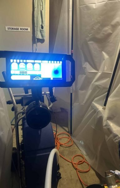 Thompson Trenchless and Hydro Jetting uses advanced equipment for pipe inspection, stored neatly in their utility room.