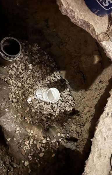 Thompson Trenchless and Hydro Jetting shows a pipe repair job where their services can fix underground plumbing issues.