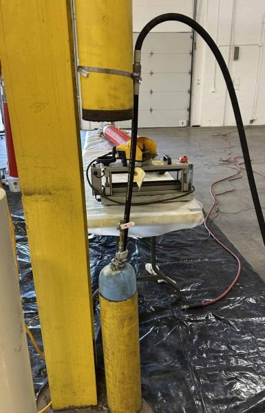 Thompson Trenchless and Hydro Jetting shows equipment set up indoors, ready for safe and efficient pipe inspections.