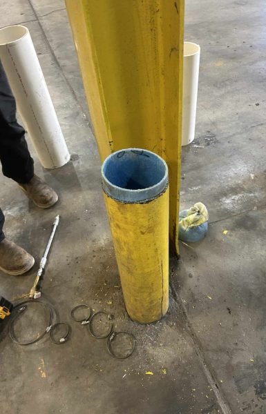 Thompson Trenchless and Hydro Jetting shows a job site with safety gear and tools for cleaning and checking pipes.