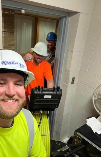 Thompson Trenchless and Hydro Jetting team shows confidence and teamwork. Workers wear safety gear and are ready for the job.