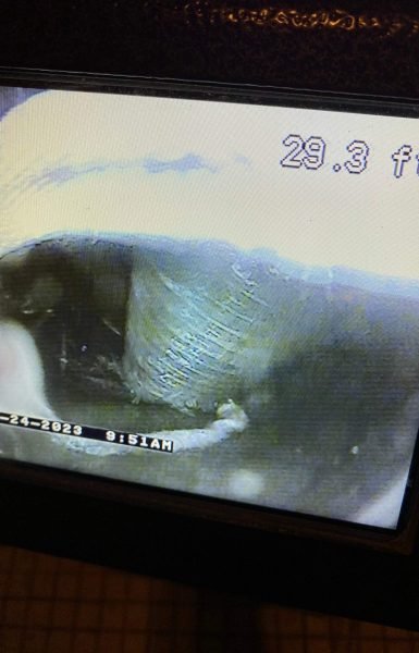 Thompson Trenchless and Hydro Jetting video shows a damaged pipe section needing expert repair.