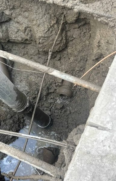 Thompson Trenchless and Hydro Jetting prepares a site for sewer repair, working safely and carefully in tough conditions.