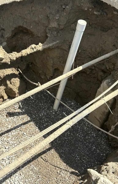 Thompson Trenchless and Hydro Jetting repairing underground pipes to solve plumbing issues at a work site.