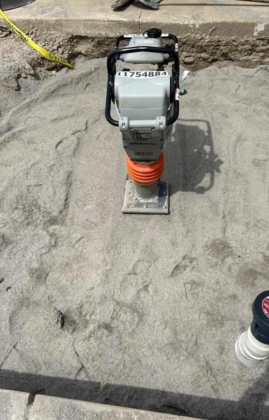 Thompson Trenchless and Hydro Jetting preps a sand base with pipes ready for drain work, showing job site readiness.